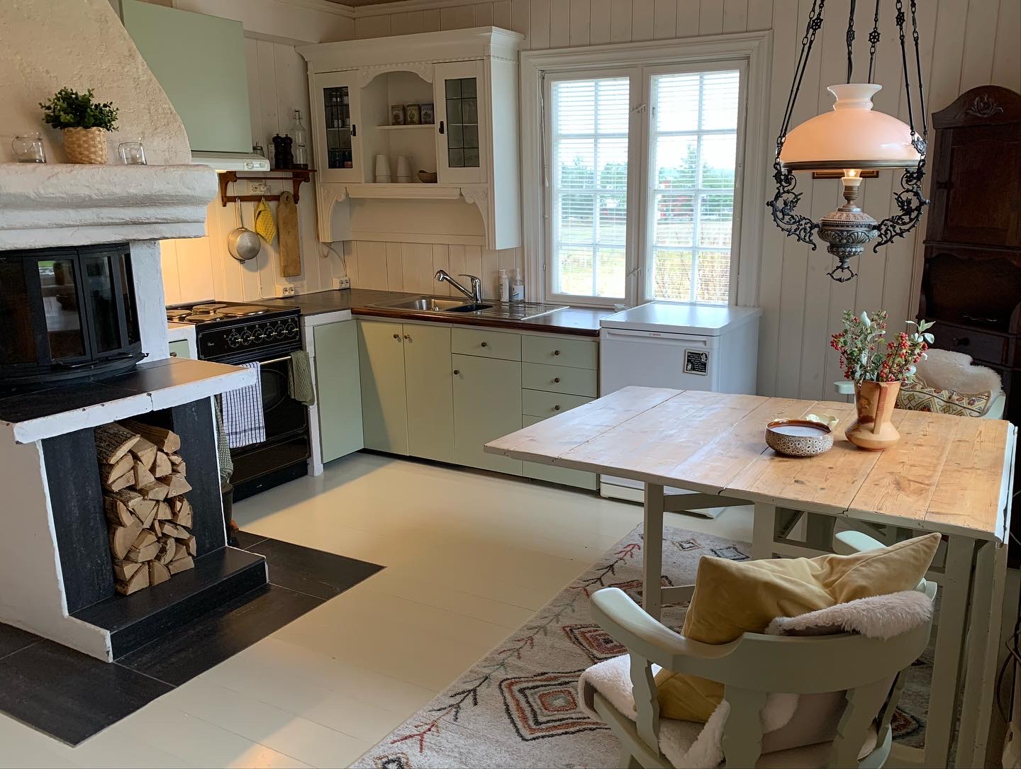 Kitchen with wood stove and dining table