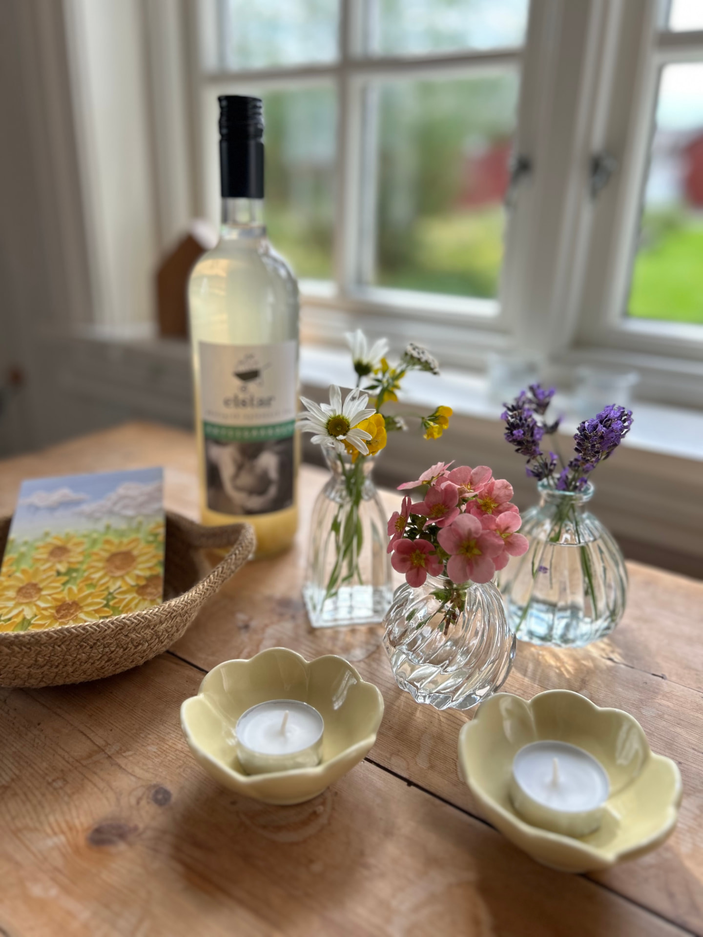Flowers, candles and wine on the table