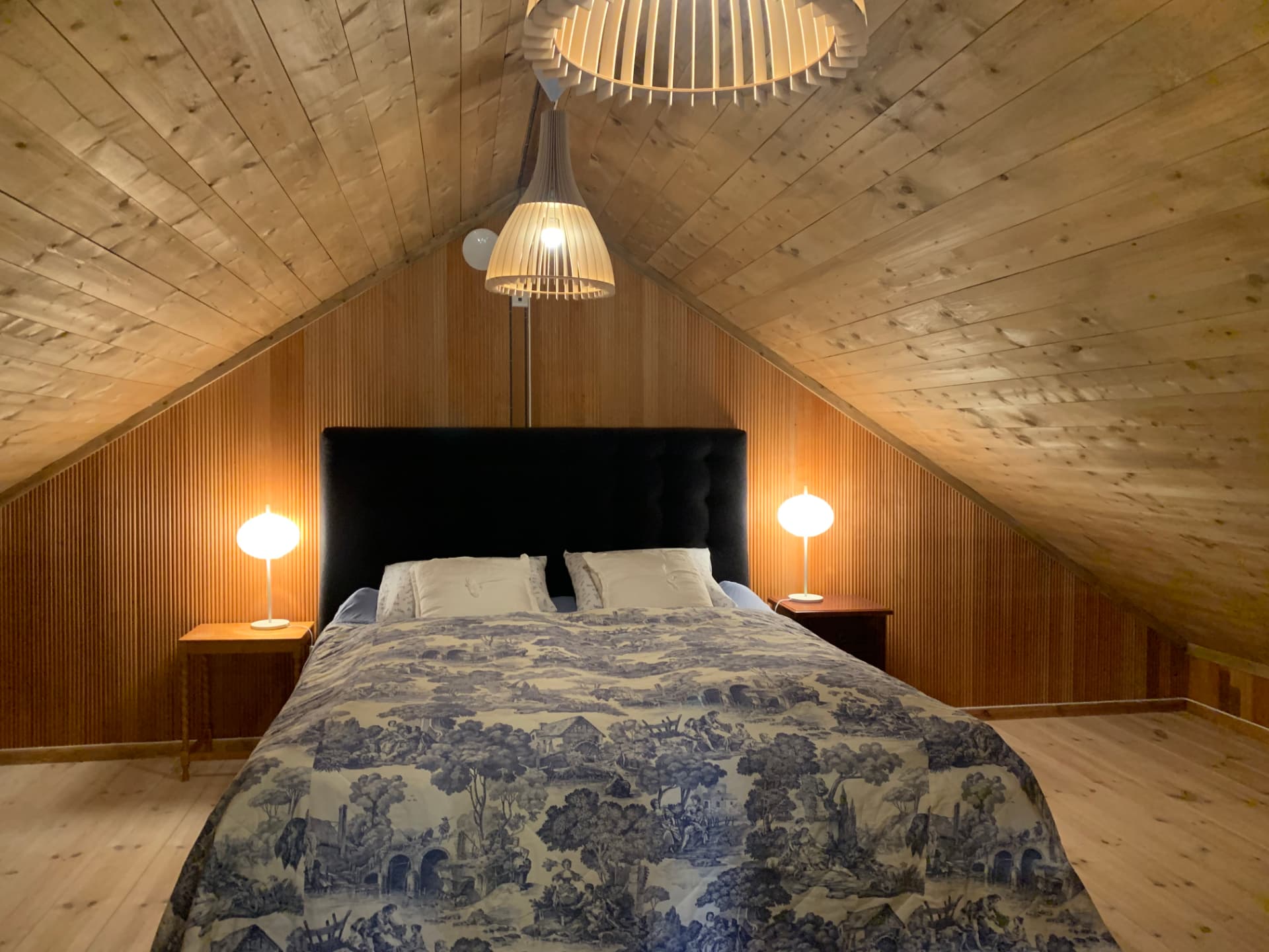 Attic bedroom with blue bedding