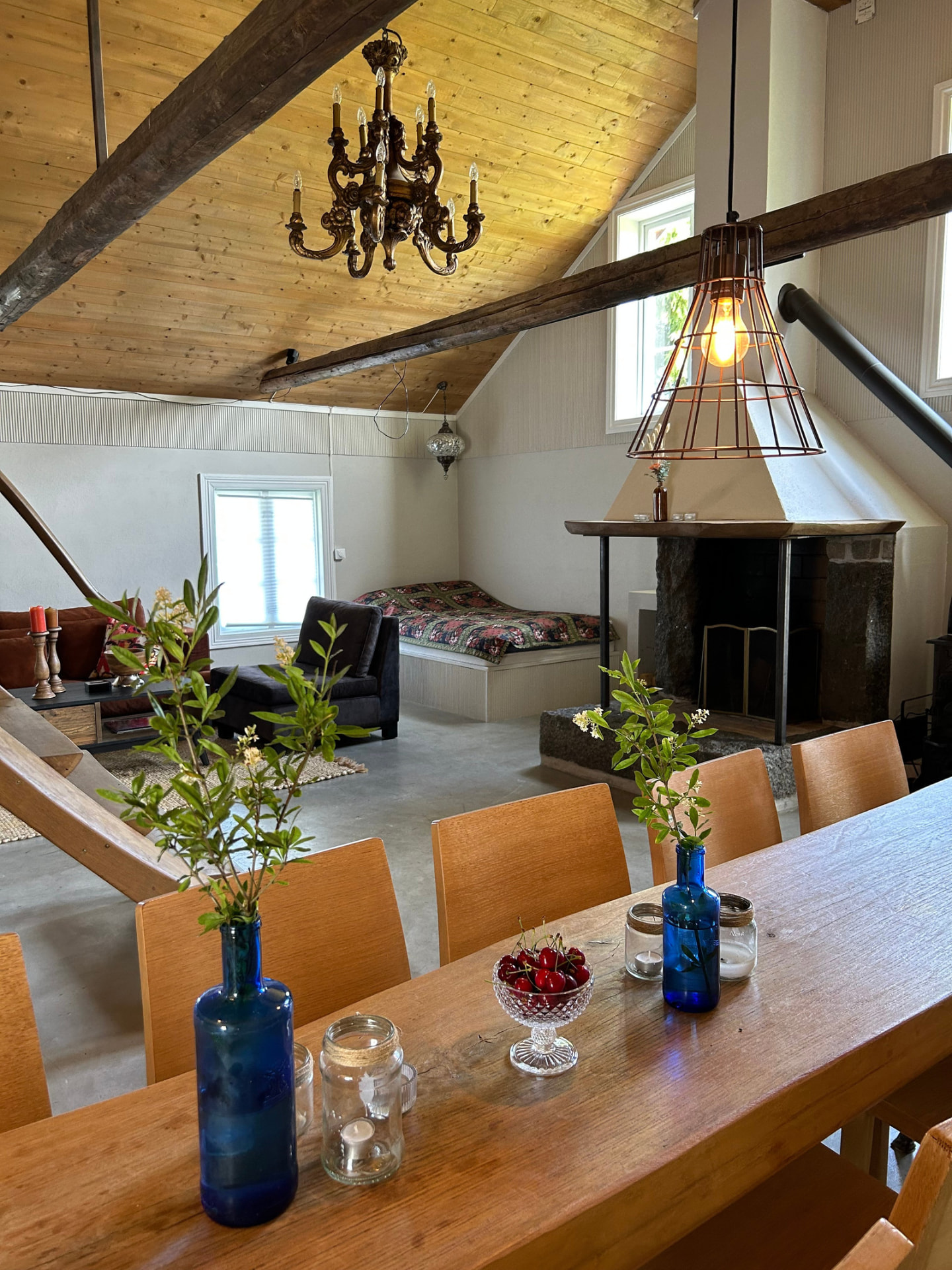 Long table with flowers by the fireplace