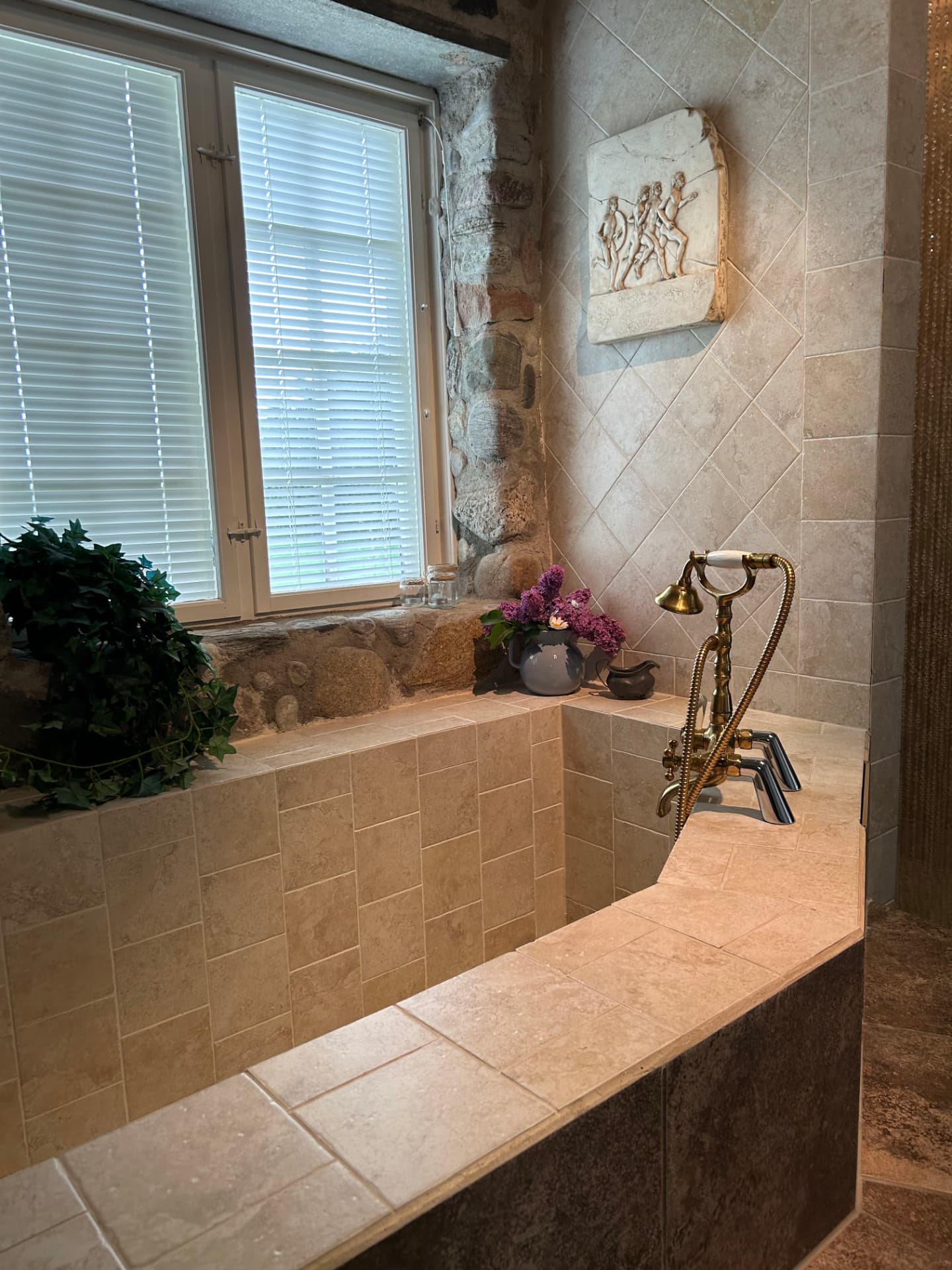 Bathroom with stone and brass details
