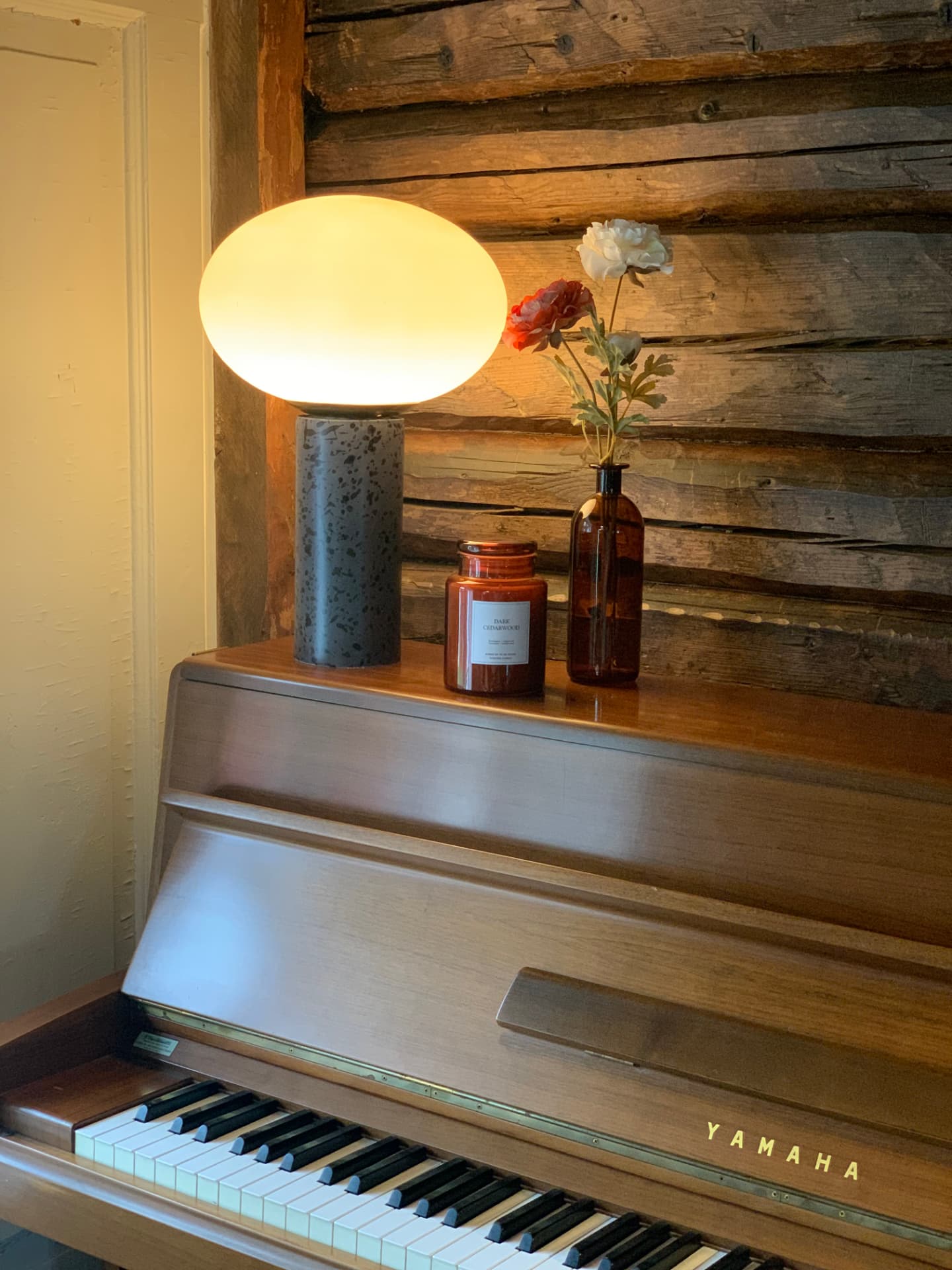 Piano with lamp and flowers