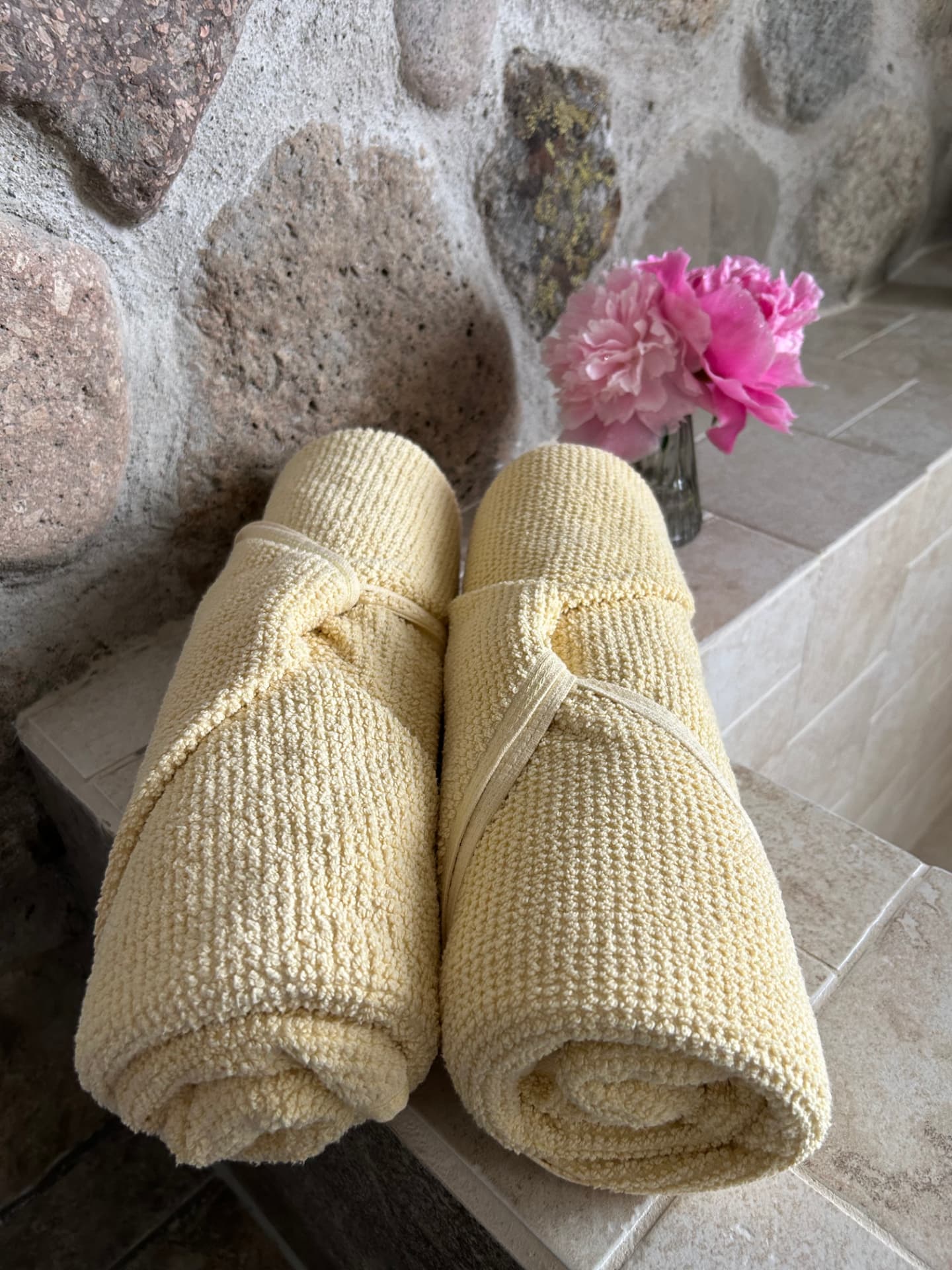 Rolled towels with a flower
