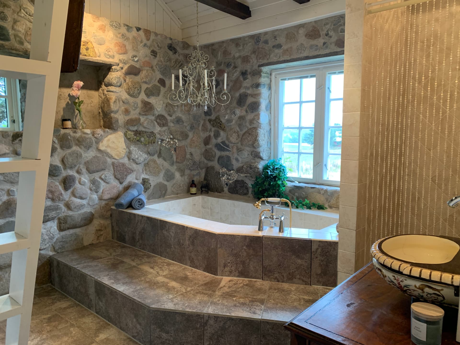 Roman bathtub beneath the stone wall