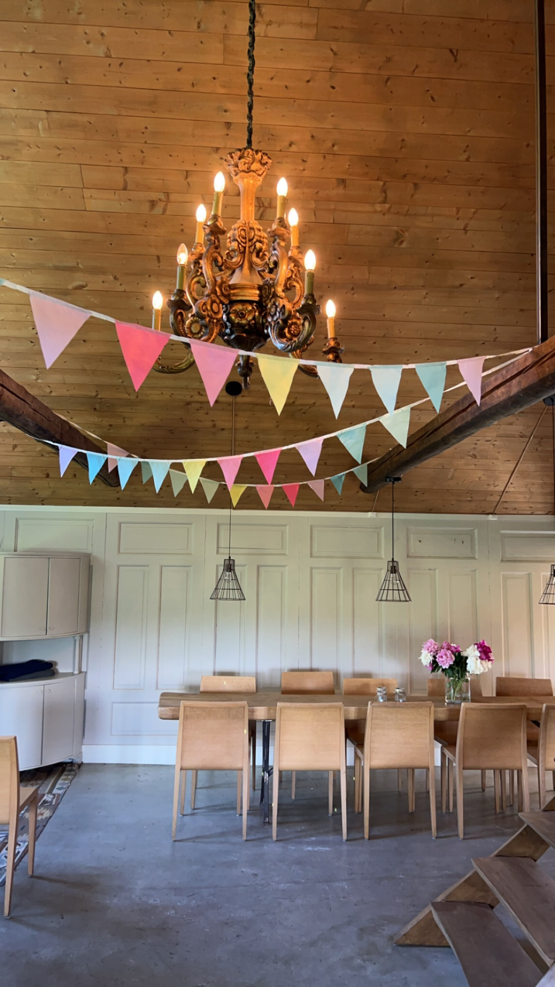 Set long table beneath the chandelier